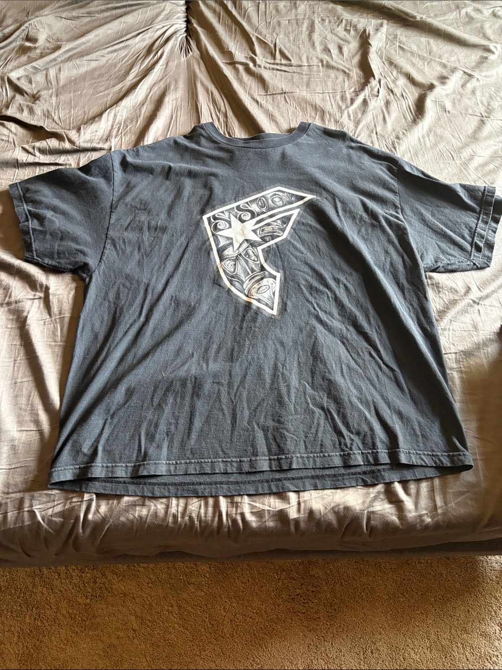 Men's Black Short-Sleeve Graphic Tee with Central Emblem